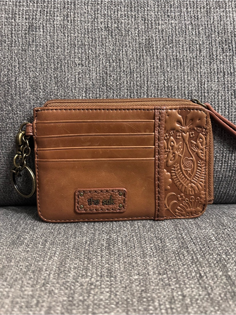 The Sak Brown Leather Iris Teak Leaf Embossed Slotted Card Travel Wallet